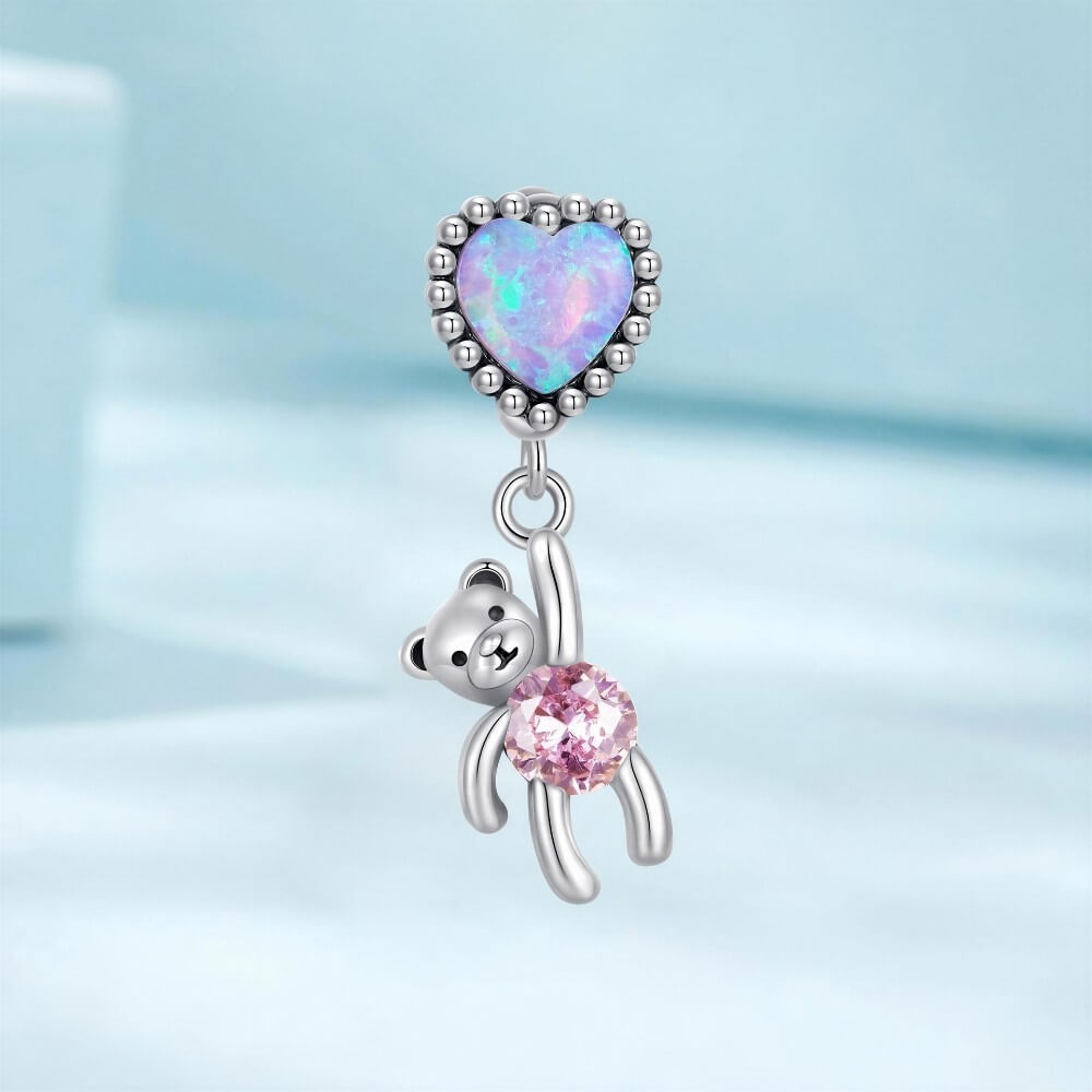 Sterling silver teddy bear charm with opal heart balloon and pink crystal.