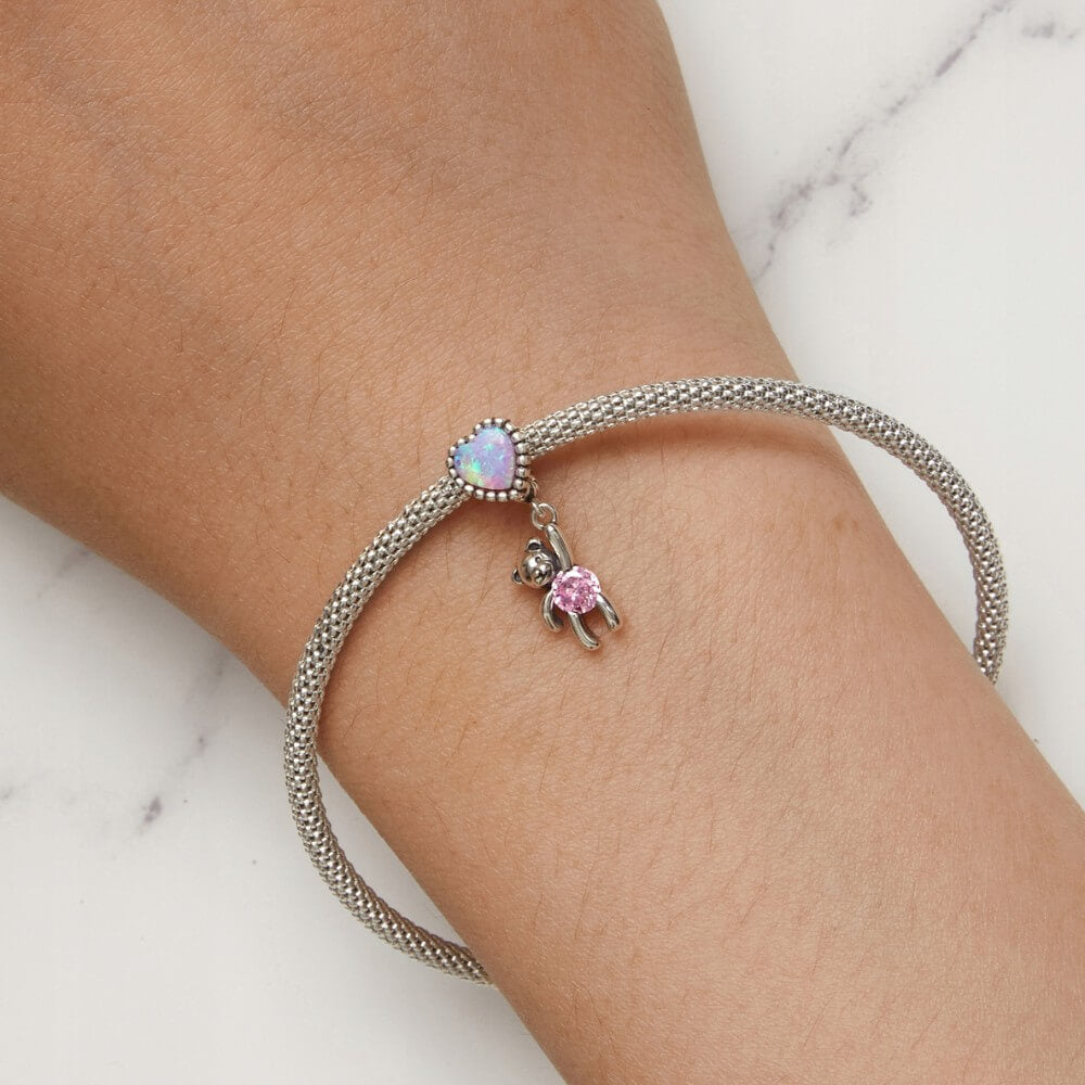 Sterling silver teddy bear charm with opal heart balloon and pink crystal.
