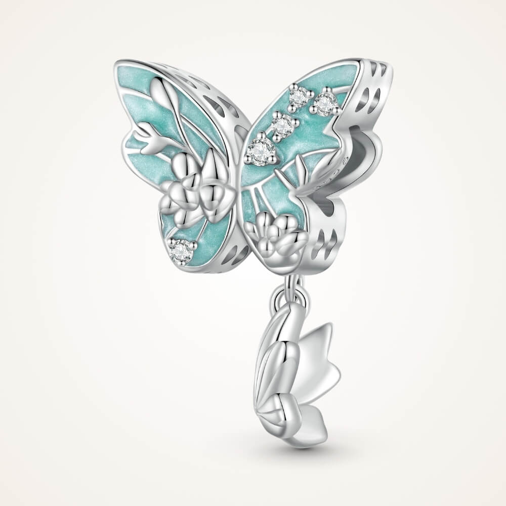 Sterling silver butterfly charm with turquoise enamel, floral details, and crystal accents - ORÉYA