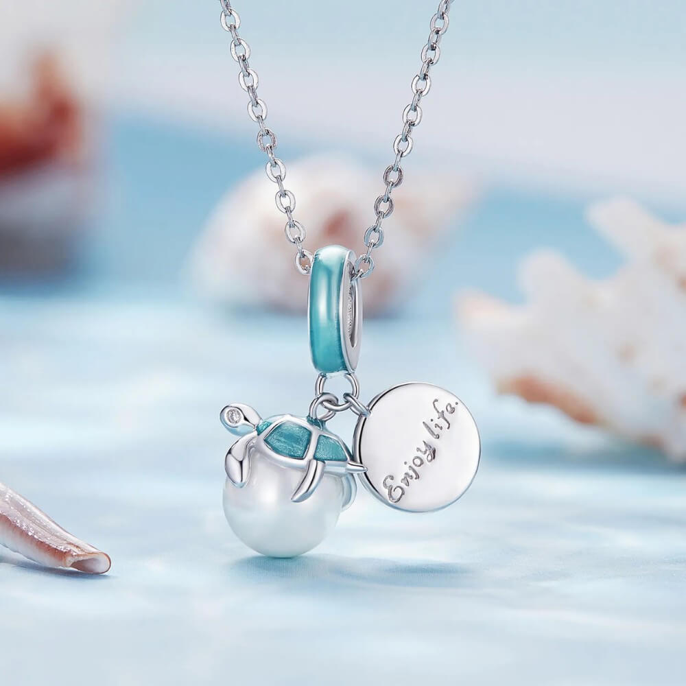 Sterling silver turtle charm with Enjoy Life engraving.