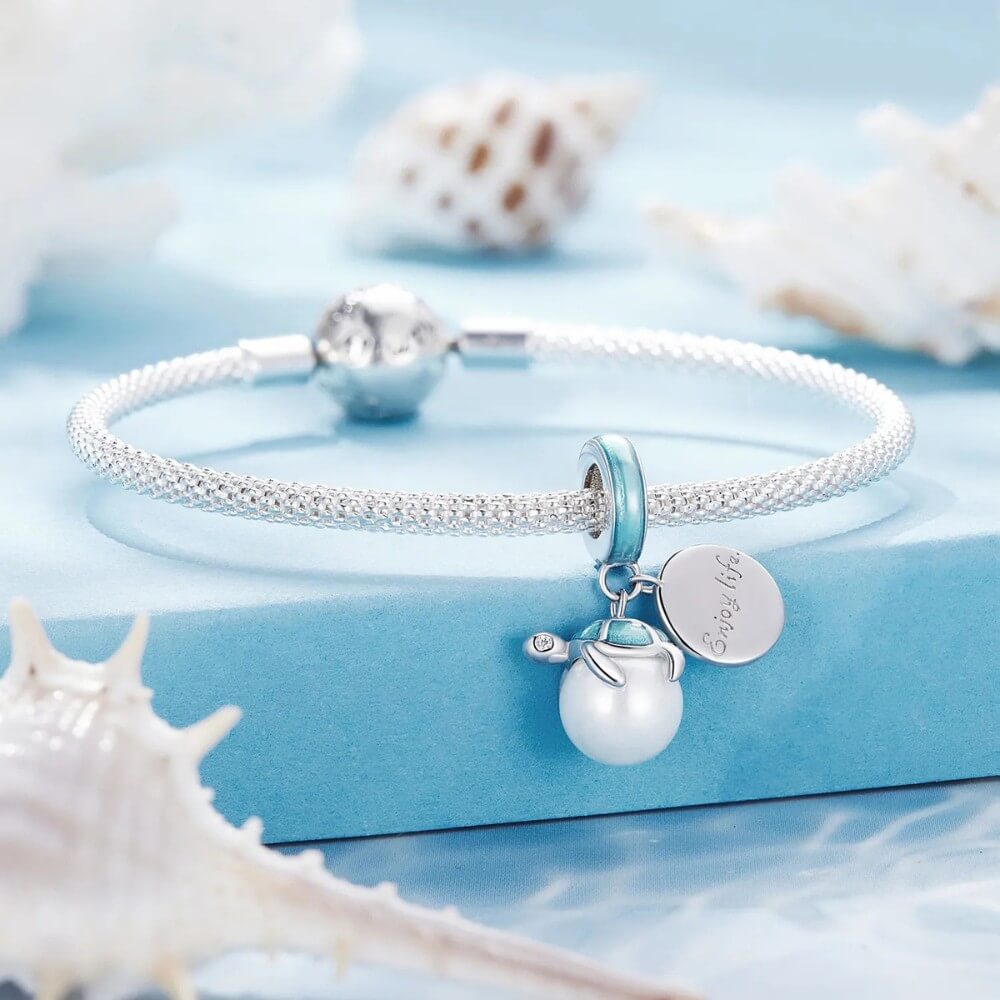 Sterling silver turtle charm with Enjoy Life engraving.