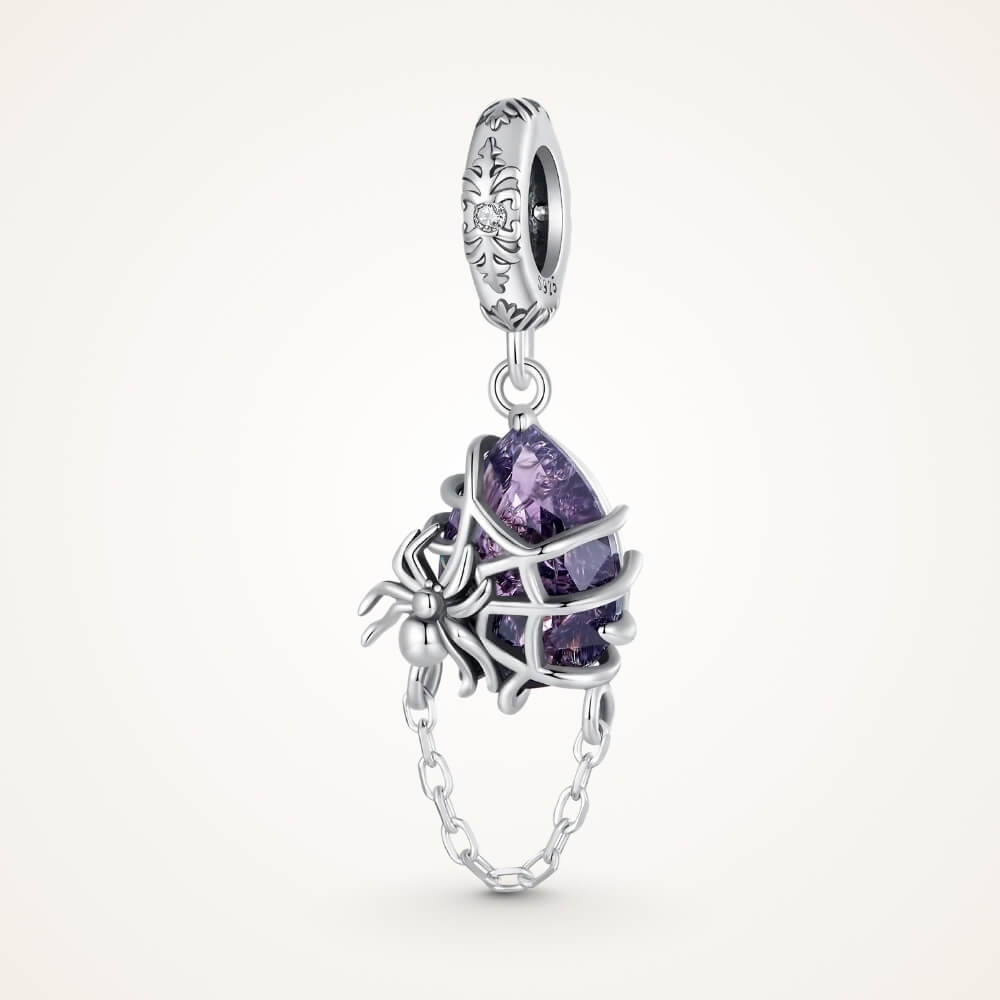 Sterling silver spider charm with violet crystal, web cage, and chain detail - ORÉYA
