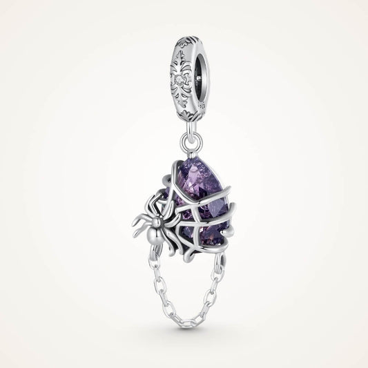 Sterling silver spider charm with violet crystal, web cage, and chain detail - ORÉYA