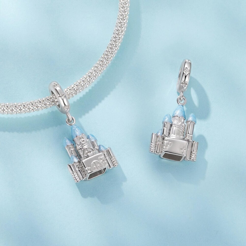 Sterling silver winter castle charm with icy blue enamel rooftops.
