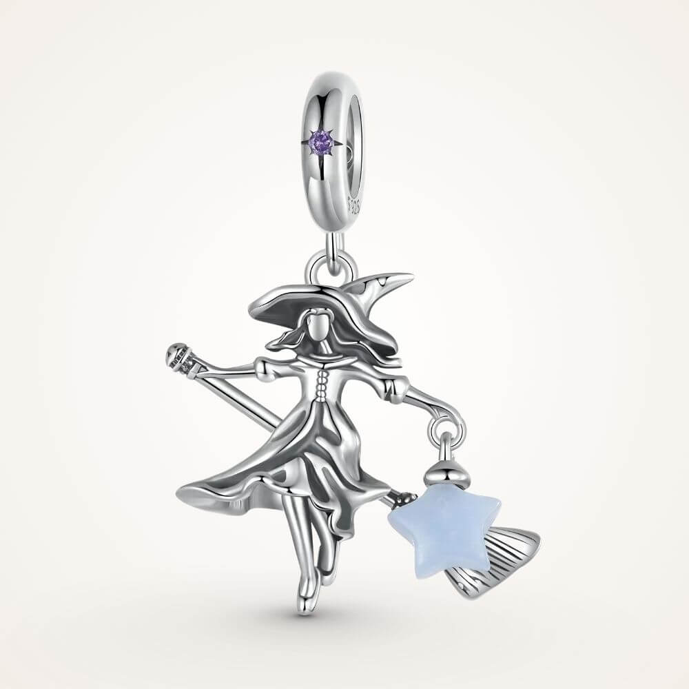 Sterling silver witch charm with broomstick, flowing dress, purple crystal, and glowing blue star lantern - ORÉYA