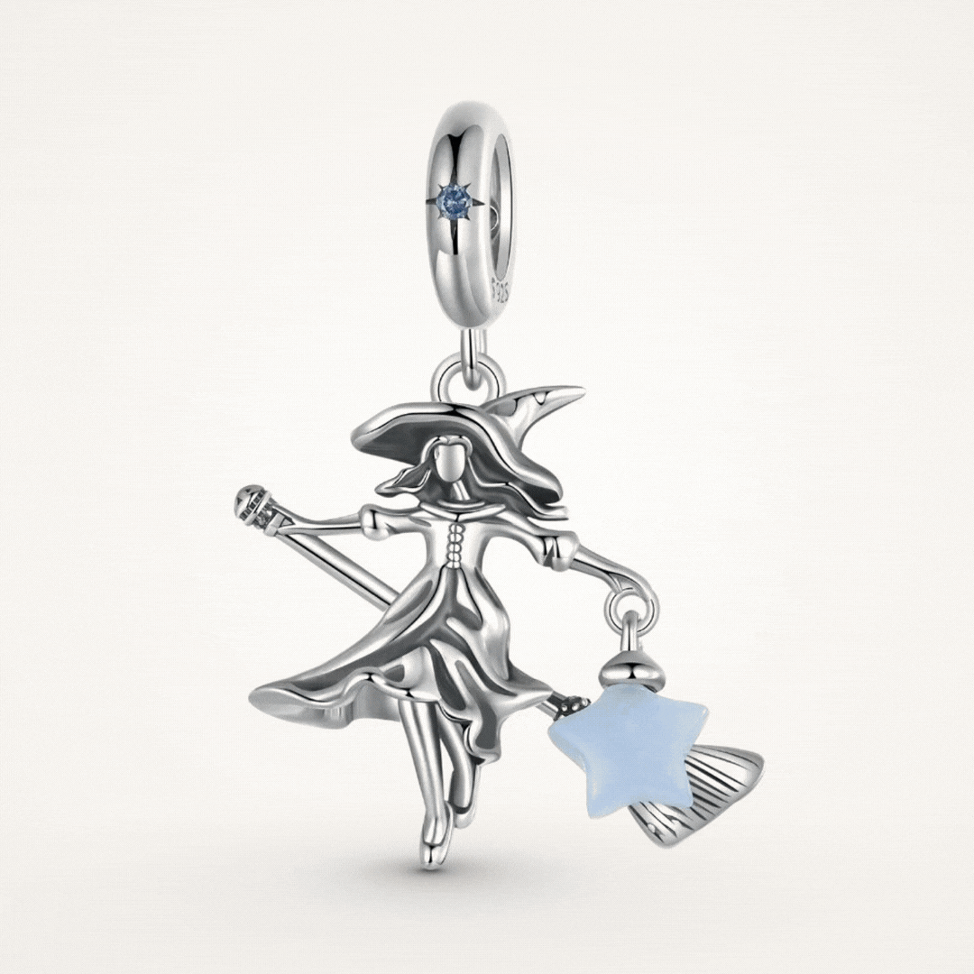 Sterling silver witch charm with broomstick, flowing dress, purple crystal, and glowing blue star lantern - ORÉYA