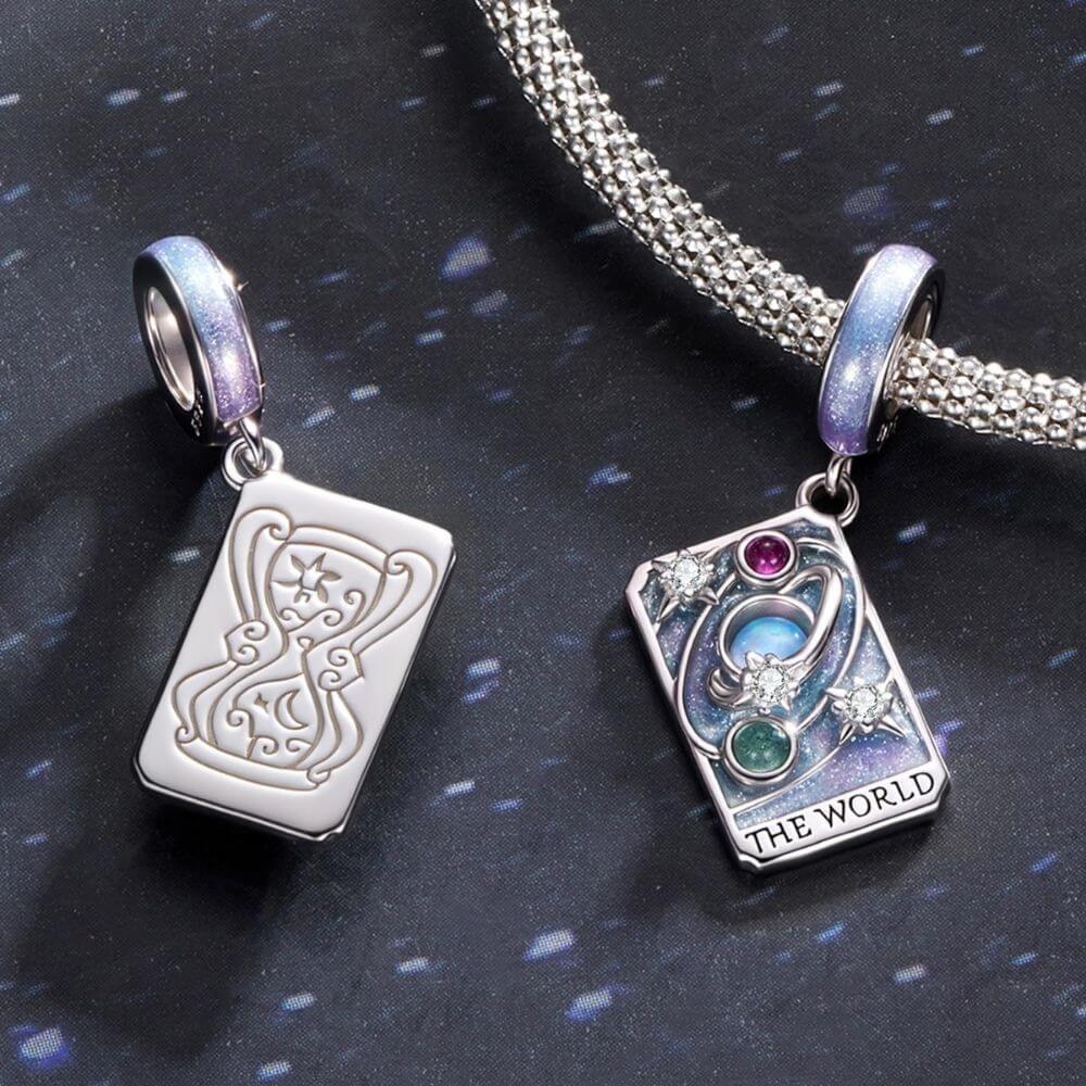 Sterling silver World tarot charm with lavender enamel, opal planet, stars, and colorful crystal details.