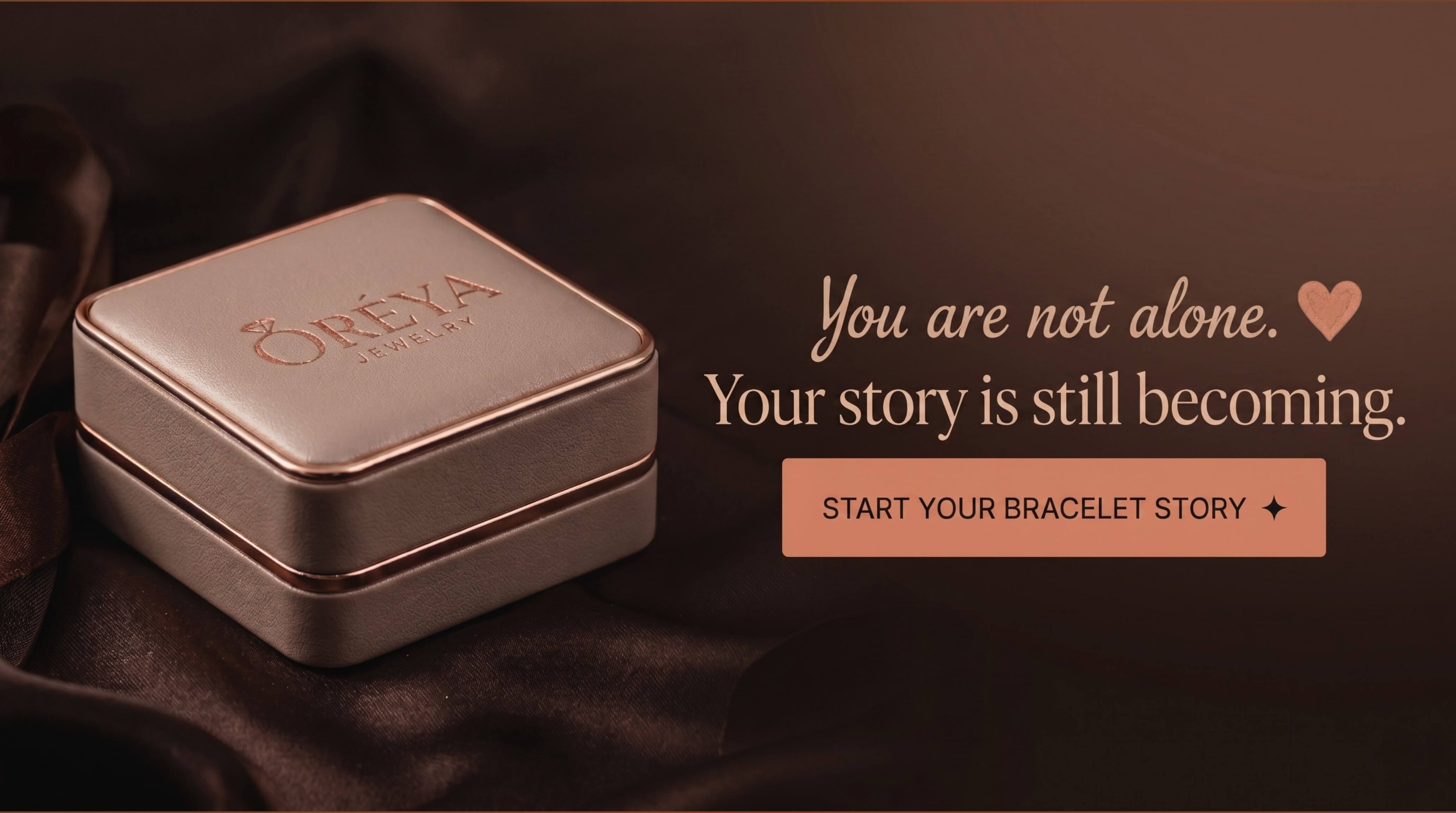 Jewelry box with ORÉYA branding on a dark background, featuring motivational text.